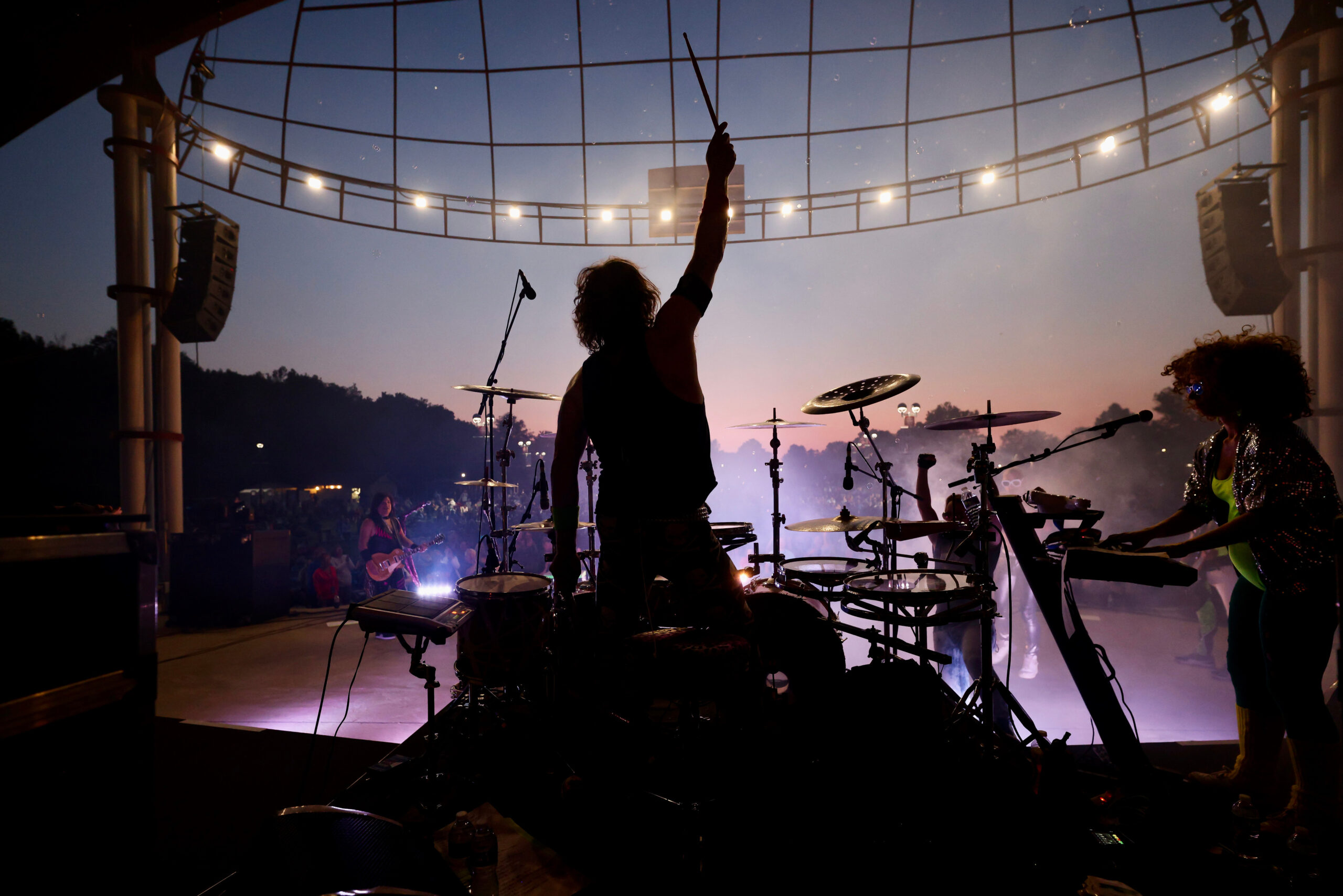 Drummer holding stick in the air